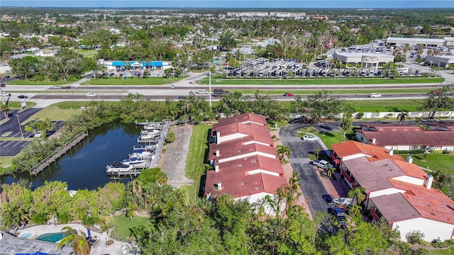 birds eye view of property with a residential view and a water view