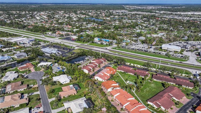 birds eye view of property featuring a residential view and a water view