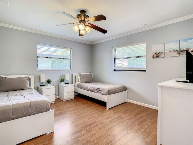 bedroom with light hardwood / wood-style flooring, ornamental molding, and ceiling fan