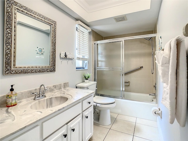 full bathroom with tile patterned flooring, vanity, toilet, and enclosed tub / shower combo