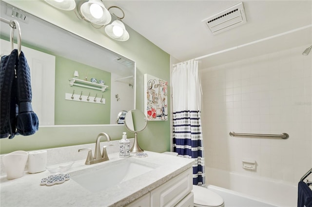 full bathroom featuring shower / tub combo, vanity, and toilet