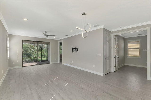 unfurnished living room with light hardwood / wood-style flooring, ceiling fan, and ornamental molding