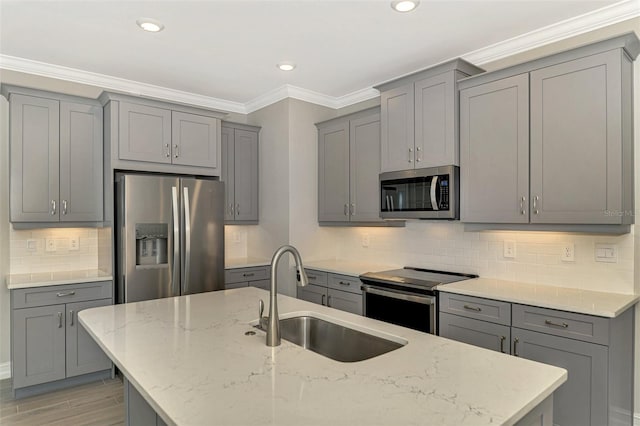 kitchen featuring gray cabinets, light stone countertops, sink, and appliances with stainless steel finishes