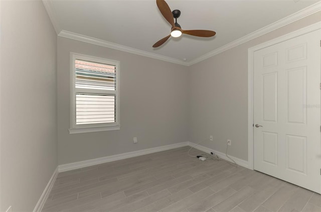 empty room featuring light hardwood / wood-style flooring, ceiling fan, and crown molding