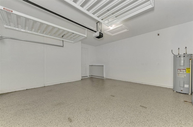 garage featuring electric water heater and a garage door opener