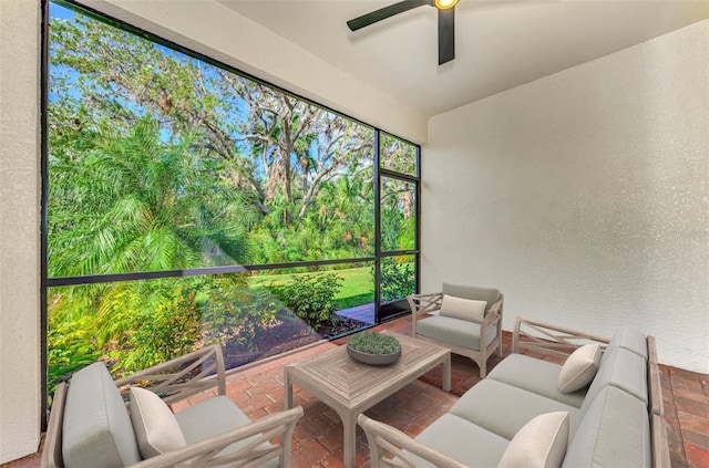 sunroom featuring ceiling fan