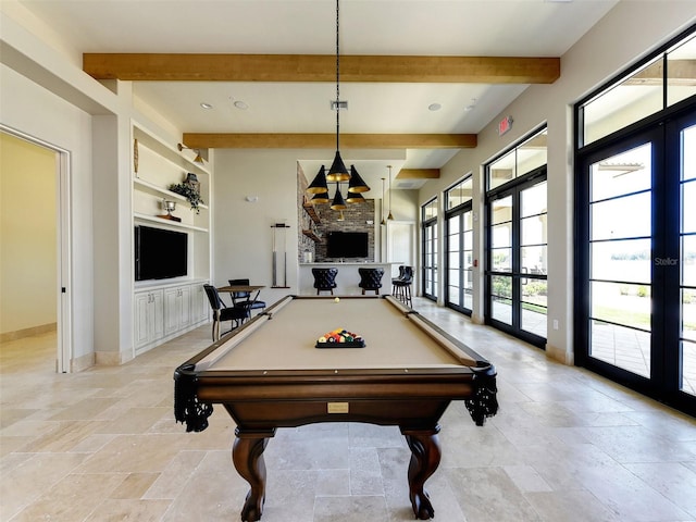 rec room with beamed ceiling, built in features, and french doors