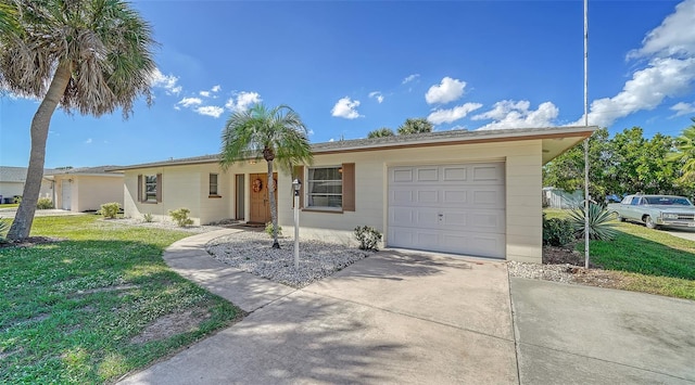 ranch-style home with a garage and a front yard