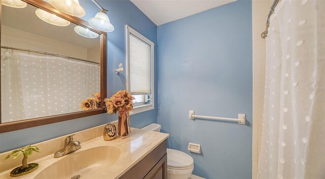 bathroom with vanity, plenty of natural light, mail boxes, and toilet