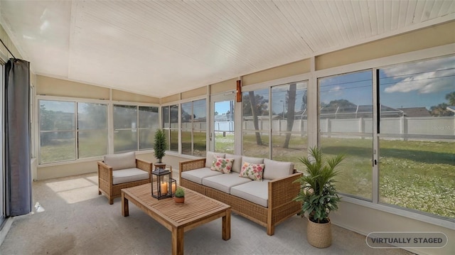 sunroom featuring lofted ceiling