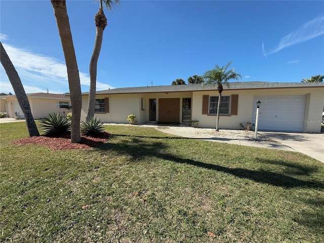 ranch-style home with a garage and a front yard