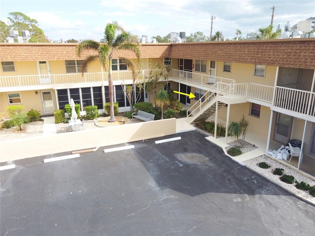 210 Park Blvd N Unit 129, Venice, FL 34285 - view of property featuring uncovered parking