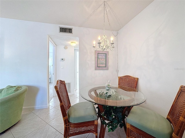 210 Park Blvd N Unit 129, Venice, FL 34285 - dining room with a chandelier, light tile patterned floors, baseboards, and lofted ceiling