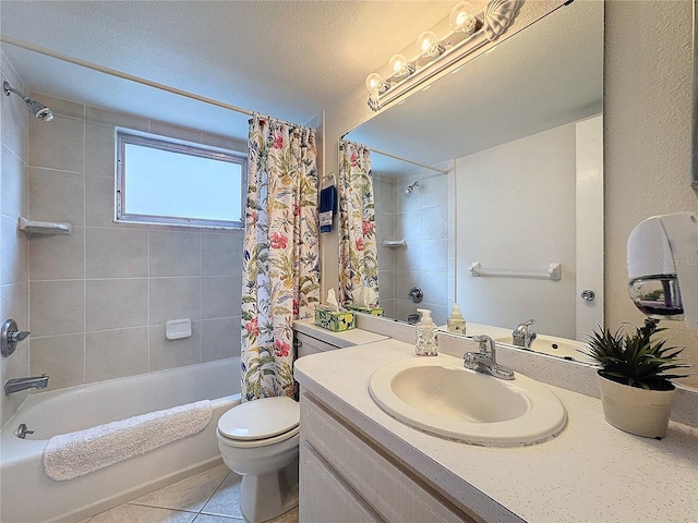 full bathroom with shower / tub combo, tile patterned floors, vanity, a textured ceiling, and toilet