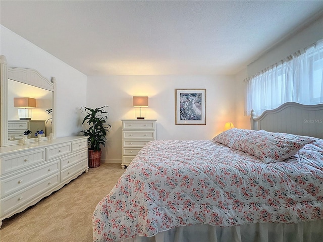 bedroom with light carpet