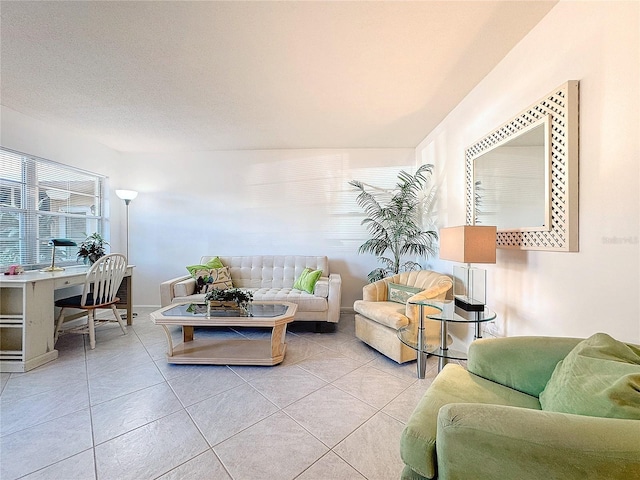 living room with light tile patterned floors and a textured ceiling