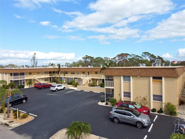 210 Park Blvd N Unit 129, Venice, FL 34285 - view of building exterior with uncovered parking