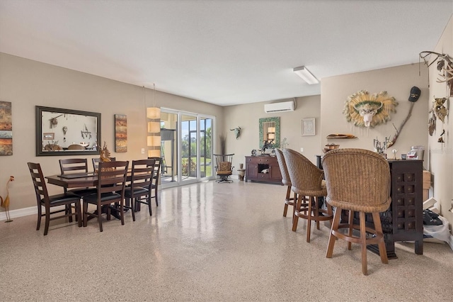 dining room with a wall mounted AC