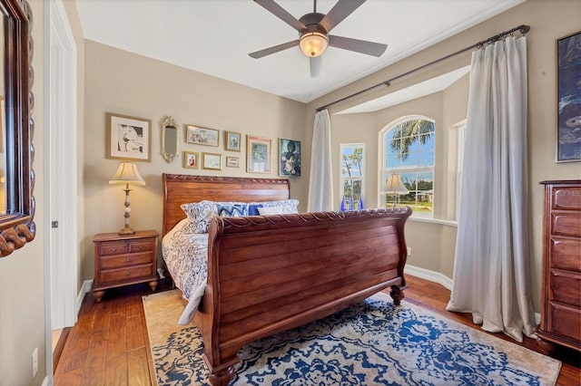 bedroom featuring hardwood / wood-style floors and ceiling fan