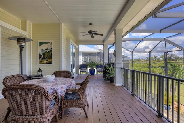 deck with glass enclosure and ceiling fan