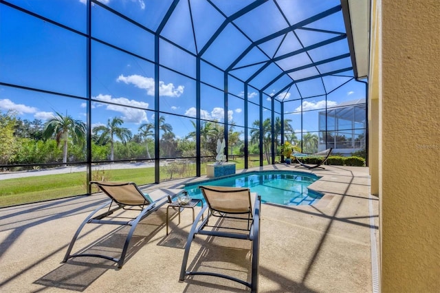 view of pool with a lanai and a patio area