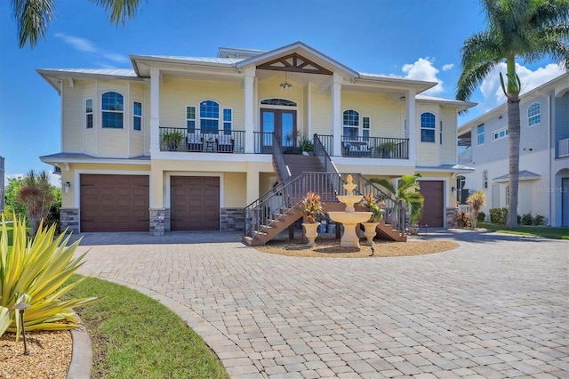 view of front of home with a porch and a garage