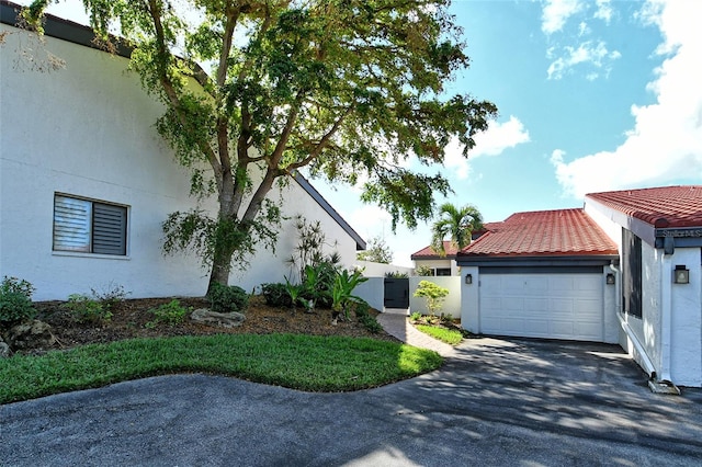 view of side of property with a garage