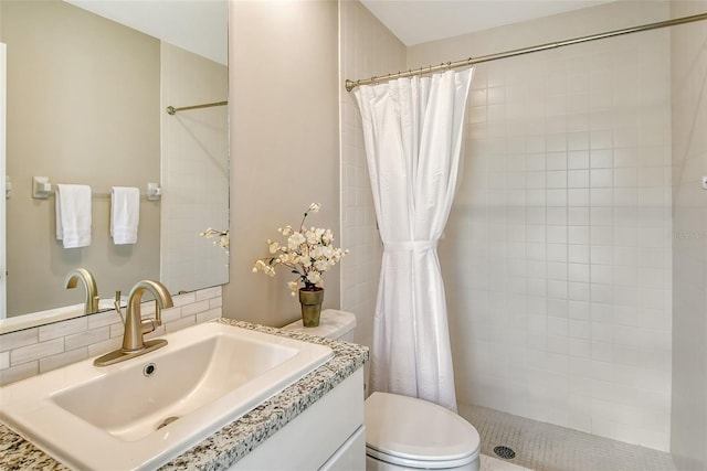 bathroom with vanity, toilet, and curtained shower