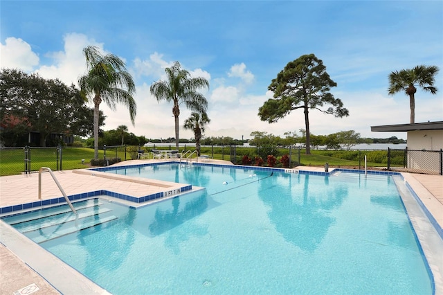 view of swimming pool featuring a patio area