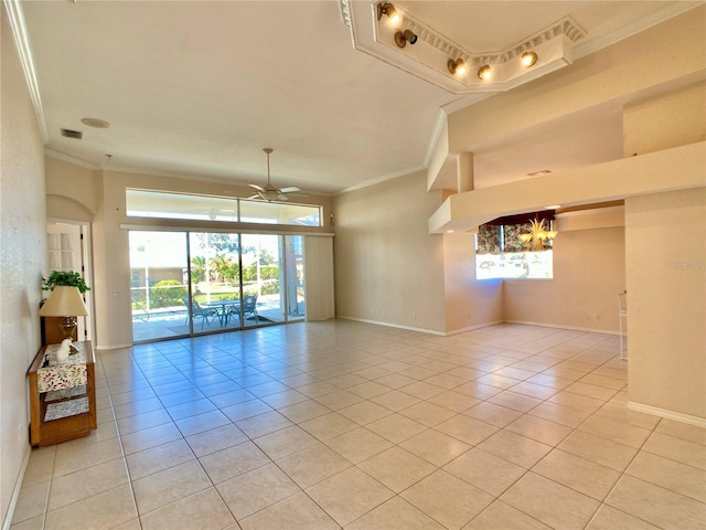 tiled empty room featuring ornamental molding and ceiling fan