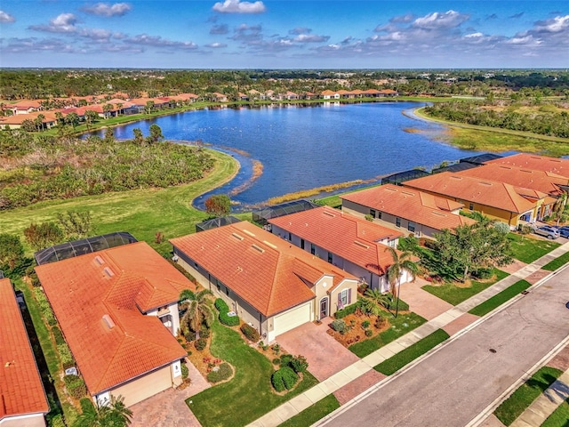 birds eye view of property with a water view