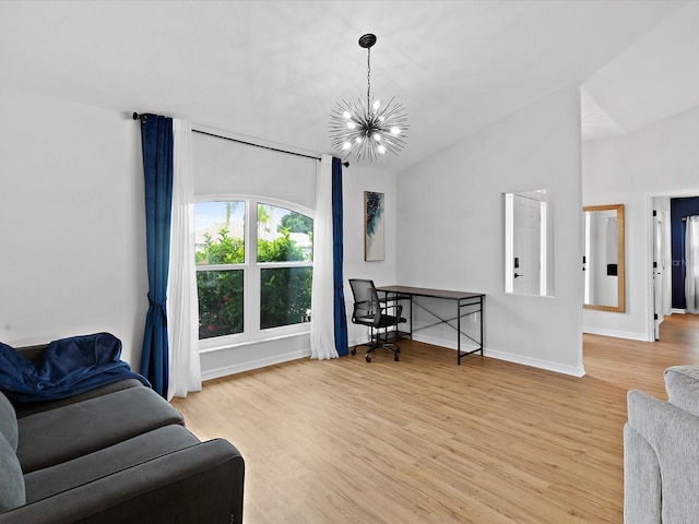 living room with a chandelier and light wood-type flooring