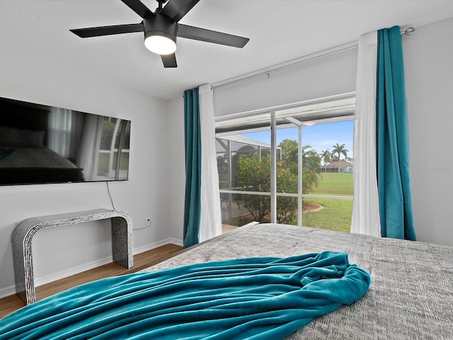 bedroom featuring hardwood / wood-style floors and ceiling fan