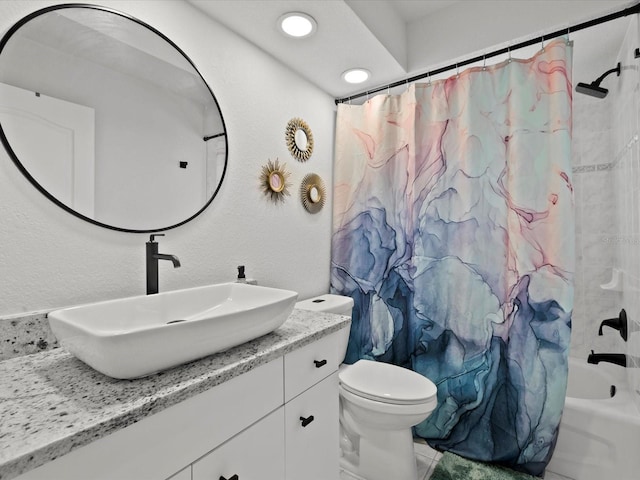 full bathroom featuring vanity, toilet, and shower / bath combo with shower curtain