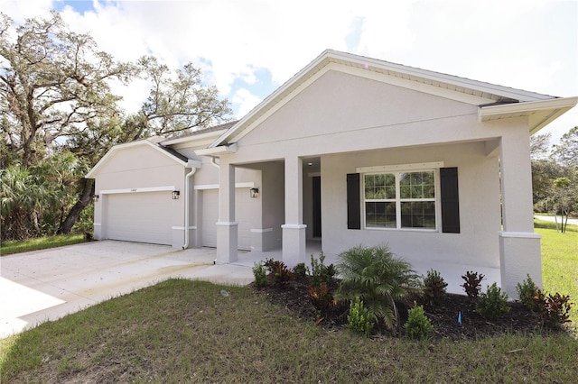 view of front of home featuring covered porch and a garage