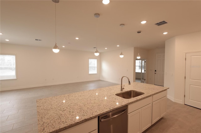 kitchen featuring dishwasher, white cabinetry, sink, and decorative light fixtures