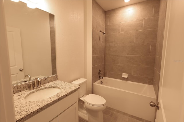 full bathroom with tile patterned flooring, vanity, toilet, and tiled shower / bath