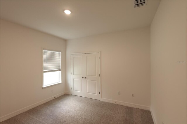 unfurnished room featuring carpet floors