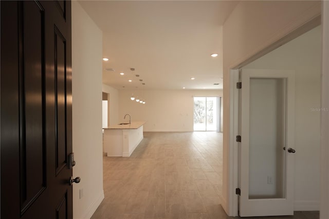 hallway featuring sink