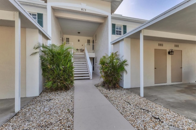 view of exterior entry with covered porch