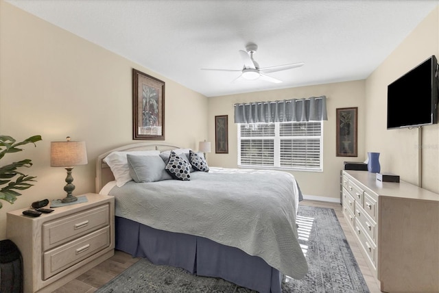 bedroom featuring ceiling fan and light hardwood / wood-style floors