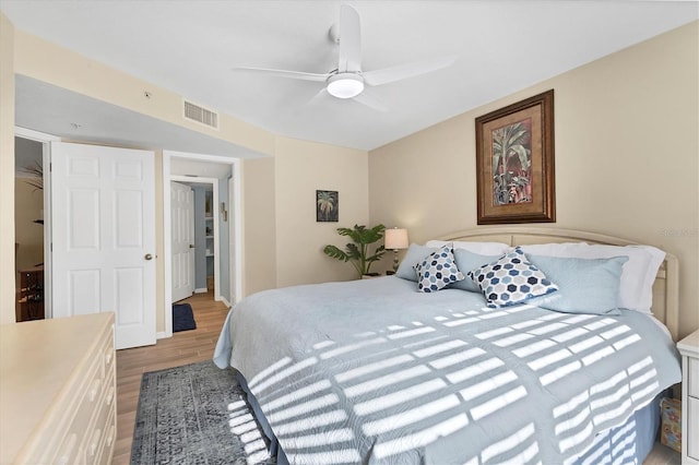 bedroom with hardwood / wood-style flooring and ceiling fan