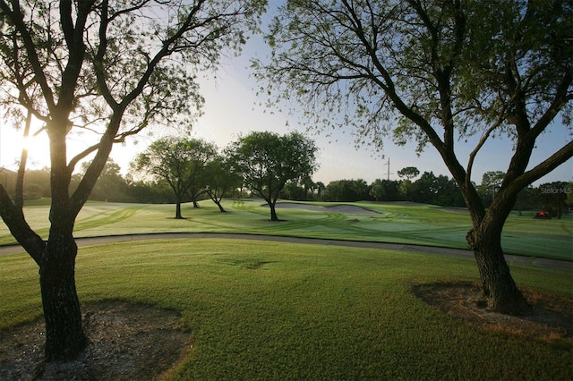 view of property's community with a lawn