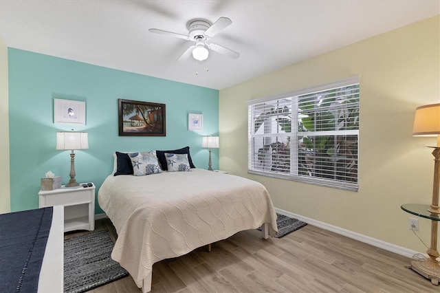 815 Montrose Dr Unit 103, Venice, FL 34293 - bedroom featuring wood finished floors, baseboards, and a ceiling fan