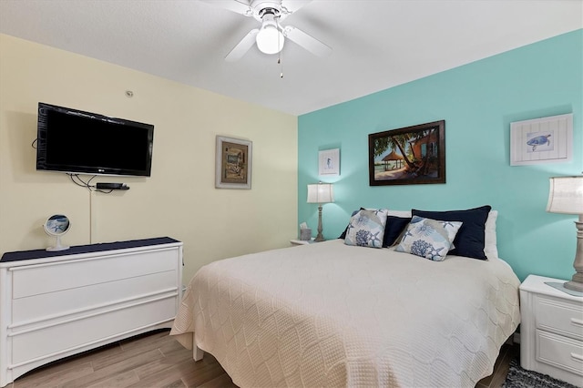 815 Montrose Dr Unit 103, Venice, FL 34293 - bedroom with wood finished floors and a ceiling fan