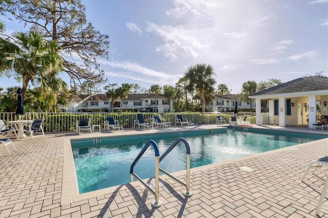 815 Montrose Dr Unit 103, Venice, FL 34293 - community pool with fence and a patio
