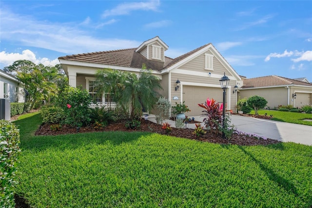 view of front of house with a garage and a front yard