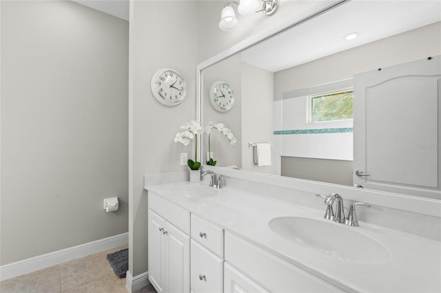 bathroom with tile patterned flooring and vanity