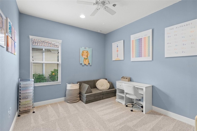 office space featuring light carpet, a wealth of natural light, and ceiling fan