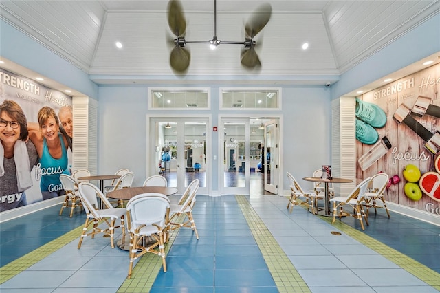 dining area featuring tile patterned flooring, high vaulted ceiling, and ceiling fan